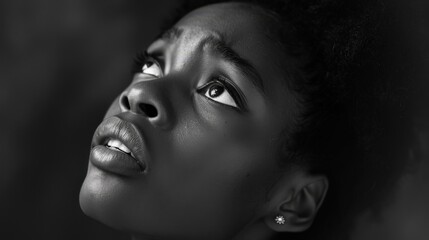  Touched by His Grace. Beautiful young black woman looking up with tears in her eyes.