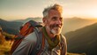 © Ben Kuang - An older man with a backpack smiles radiantly while hiking in the mountains at sunset, embodying adventure and the joy of nature.