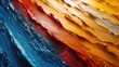 Close-up detail of vibrant oil paint strokes in blue, red, and yellow hues, highlighting artistic texture.