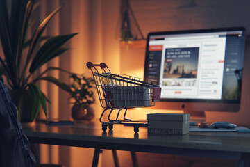 Wall Mural - A laptop computer is open to a website with a shopping cart on it