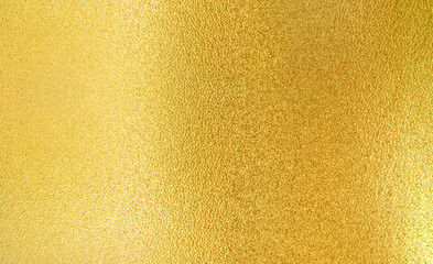 Luxury gold gradient light shiny glitter texture background. Golden shiny foil gradient metallic metal polished sheet with gloss light reflection, vibrant golden metal wall wallpaper