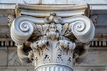 Classical Architectural Detailing, Specifically A Corinthian Column Capital With Its Distinctive Acanthus Leaves, Showing The Elegance And Craftsmanship Of Historical Architecture