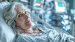 © aekkorn - middle aged woman lies in a hospital ward, connected to life support equipment, monitors.