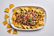 mexican food, nacho chips, sauce, vegetables, olives, abstract background