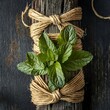Fresh mint with old twine. On dark rustic background