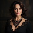 Portrait of a mature woman with black hair wearing a necklace with precious stones, diamonds crystals. Attractive brunette woman with short wavy hair wearing a large luxurious necklace dark background