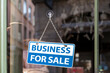 © BreizhAtao - Business for sale sign in a store window