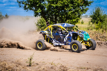 UTV kicking up sand on a dune. Extreme. 4x4.