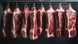  Rows of fresh hung half cow chunks in a large fridge in the meat industry on black background