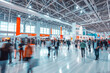 Large Crowd of motion blur anonymous people walking at the trade show