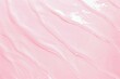 Flat lay of water surface on pastel pink background. Summer or cosmetic background
