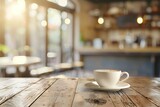 Cup of coffee on table in cafe on blurred background, sunlights and outdoors