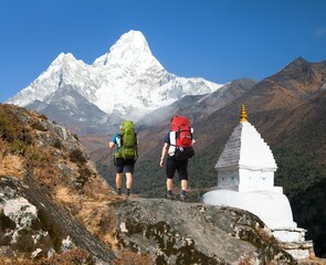 Canvas Print - Mount Ama Dablam white Stupa and two hikers