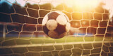 Fototapeta Sport - A close up view of the soccer ball in the soccer gate football goal.