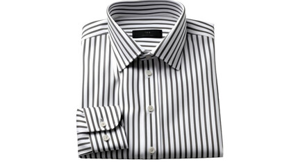 A striking black and white striped shirt stands out against a clean white background