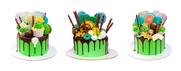 Wall Mural - Green cakes with chocolate decorations, lollipops, stars, popsicles and cupcakes on plain white background, copy space