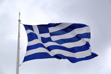 Wall Mural - greek flag waving against sky