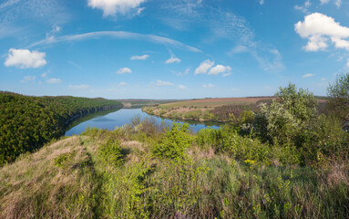 Wall Mural - Amazing spring view on the Dnister River Canyon with picturesque rocks, fields, flowers. This place named Shyshkovi Gorby,  Nahoriany, Chernivtsi region, Ukraine.