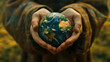 Close-up of hands holding green earth. The concept of sustainable development of ecology and environment. World Earth Day.