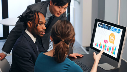 Poster - Multinational businesspeople talking while looking at PC monitor in the lobby. International business.