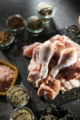 Canvas Print - Raw chicken seasoned with various spices	