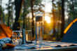 Compact personal water purifier on a camping table forest background