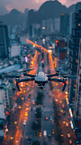 Fototapeta Do akwarium - A camera-equipped drone hovers above a bustling city street as evening traffic lights stretch into the distance.