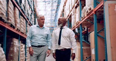 Canvas Print - Warehouse, collaboration and men walking in manufacturing, export and storage company. Management, stock and business people with inspection of freight and supply chain with conversation and planning