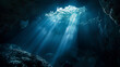 A deep blue cave with sunlight shining through the cracks. The light is reflecting off the water and creating a beautiful scene