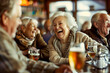 Senior people laughing with beers at pub