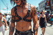 © alexkoral - body of a sexy gay man in tattoos and leather harness at the LGBT Pride Parade