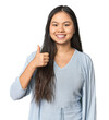 © Asier - Young chinese woman isolated smiling and raising thumb up