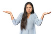 © Asier - Young chinese woman isolated doubting and shrugging shoulders in questioning gesture.