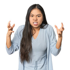 Wall Mural - Young chinese woman isolated screaming with rage.