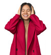© Asier - Young chinese woman isolated laughs joyfully keeping hands on head. Happiness concept.