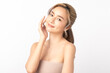 © Shutter B - Happy beautiful young asian woman smile touching her face on white background, clean fresh bare skin concept. Facial treatment, Perfect skin, Natural make up.