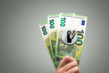 Fototapeta Miasto - Key in a Lock on Euro Banknotes - Financial Concept