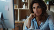 © VK Studio - Thoughtful businesswoman in office setting, her gaze revealing focus and determination.