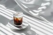 A glass of iced black coffee on white background and Clean composition, minimal style