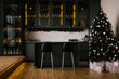 Beautiful minimalistic interior of a black kitchen with a backlight with glasses behind glass and a bar, next to a Christmas tree