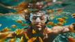Snorkeler Surrounded by Tropical Fish Underwater,An underwater view of a snorkeler immersed in clear waters teeming with vibrant yellow tropical fish, enjoying the marine world.

