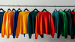 Different colorful youth cashmere sweaters and hoodies, sweatshirts and on a clothes rack