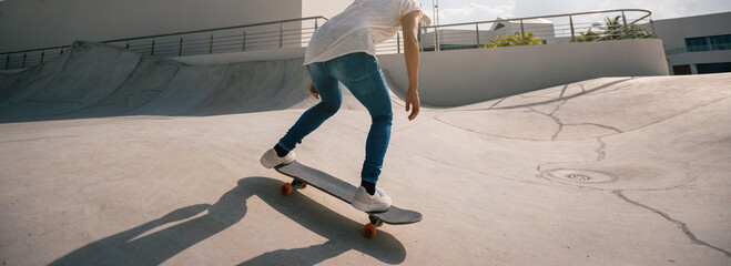 Wall Mural - Skateboarder skateboarding at skatepark in city