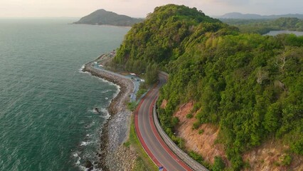 Wall Mural - car driving on the road of Thailand. road landscape in summer. it's nice to drive on the beachside highway. Chantaburi Province Thailand, Road along the beach and ocean is very beautiful.