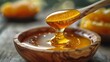 Wooden Spoon Filled With Honey on Table
