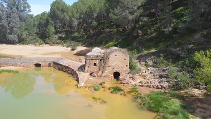 Wall Mural - Aerial drone view of old watermill in the shore of Odiel river in the hiking route of the water mills along the Odiel river from Sotiel Coronada, in Huelva province, Andalusia, Spain