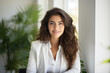 © vefimov - Woman with long brown hair is sitting in chair and smiling