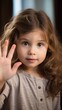 A Young Child Waving Goodbye with One Hand. Fictional character created by Generated AI. 