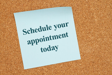 Wall Mural -  Schedule your appointment today on a sticky note on corkboard