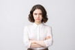 © Sascha - A woman wearing a white shirt and brown skirt